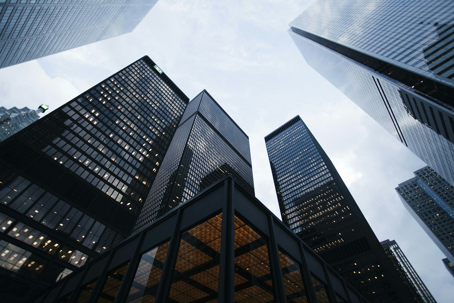 A quiet upward view between modern glass towers